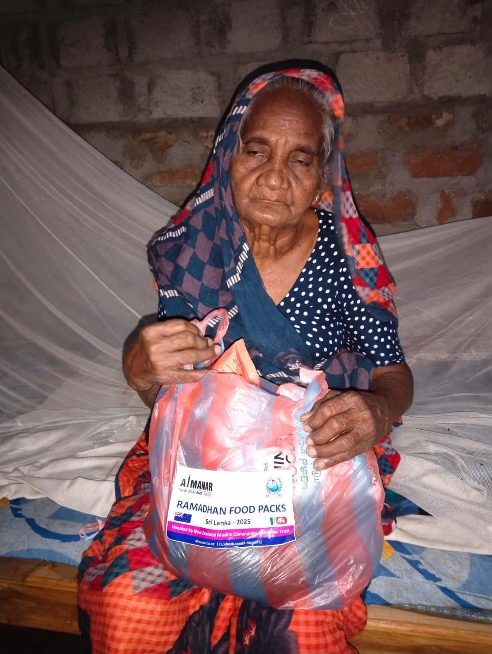 a elder woman got a food pack
